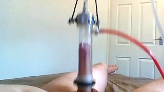 mistress milking boys cock with a penis pump machine
